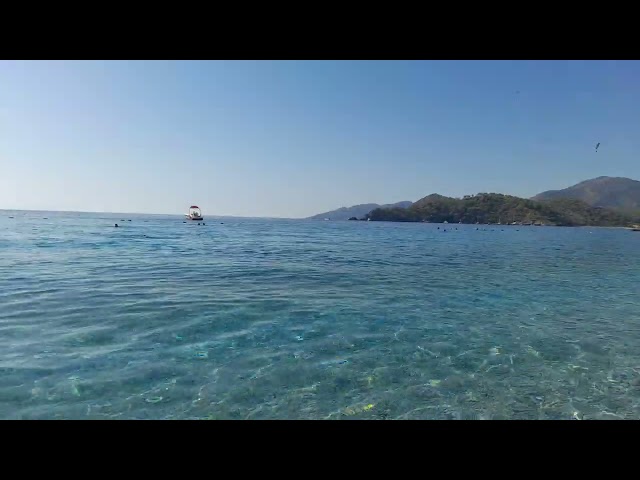 ölüdeniz plaji tertemiz deniz prıl prıl turkuaz su Ölüdeniz beach, crystal clear sea turquoise water